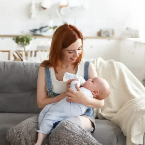 "A mother and baby participating in a virtual physical therapy telehealth consultation from home with an Atlanta Lactation specialist.