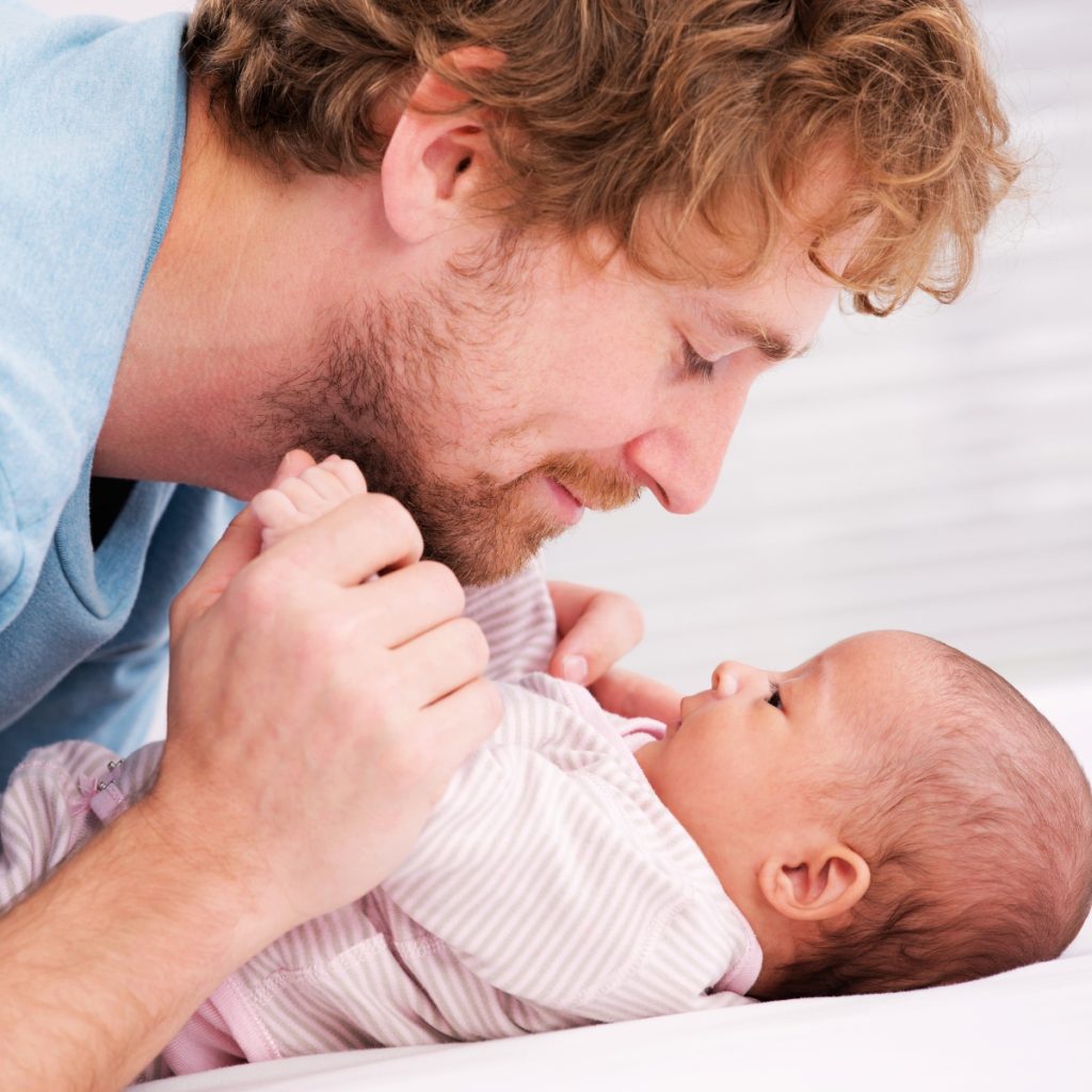 Lactation specialist providing in-home breastfeeding support and latch guidance for a new family